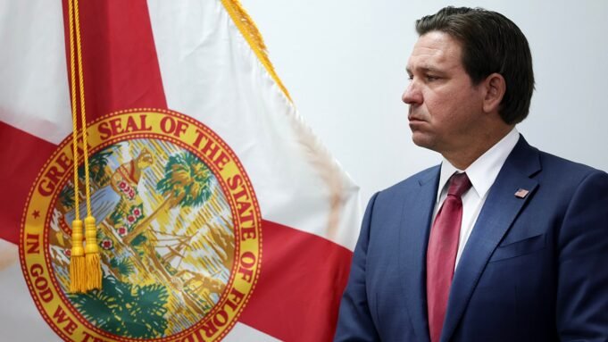 ron-desantis-and-florida-flag.jpg