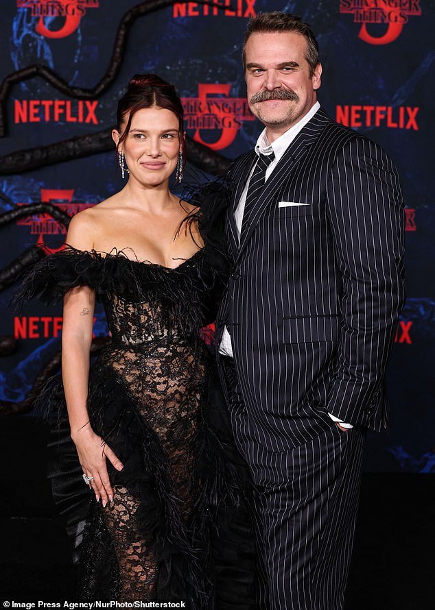 104246367-15332453-David_Harbour_and_Millie_Bobby_Brown_have_plenty_of_emotional_sc-a-32_1764264210511.jpg
