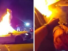 Policjant wyciąga kobietę z płonącego pojazdu po kraksie samochodowej, na nagraniu wideo